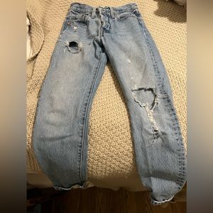 Levi’s straight leg jeans rib cage, with holes.